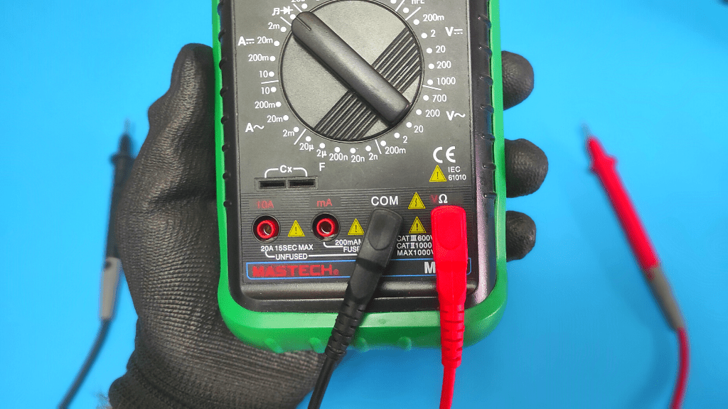 plug probes into multimeter