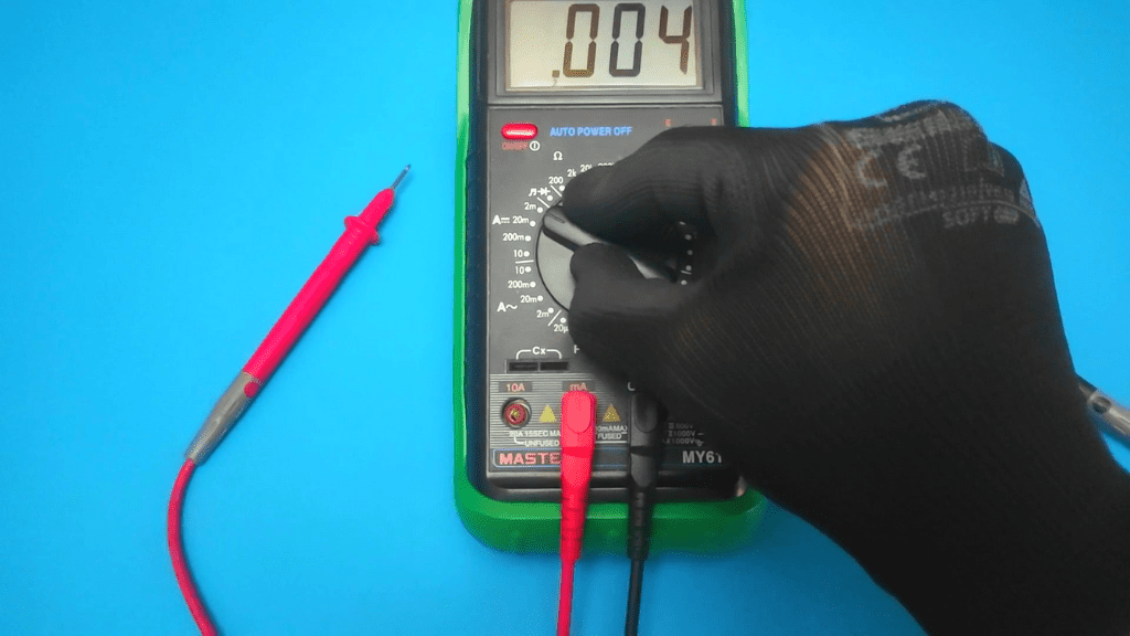 set the multimeter to the closest dc current range