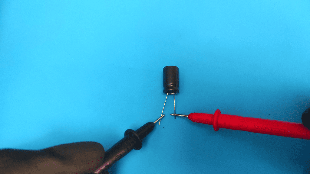 place probes on capacitor pins